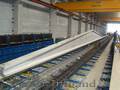 Standuri reconfigurabile pentru producția de produse din beton armat